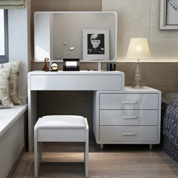 Table and chest of drawers in the bedroom photo