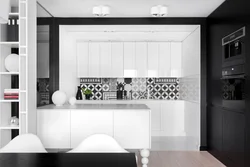 White kitchen on black tiles photo