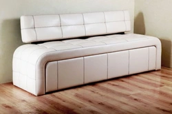 Narrow sofa with sleeping place photo