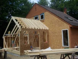 Extension of a bathtub to a wooden house photo