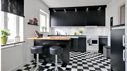 Black and white tiles kitchen floor photo