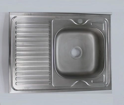 Overhead kitchen sinks made of stainless steel photo