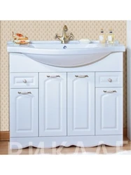 White cabinets with sink in the bathroom photo