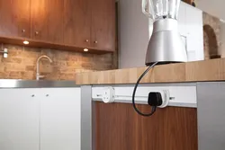 Sockets on the countertop in the kitchen photo in the interior