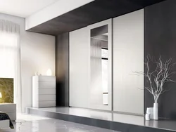 Wardrobe in the hallway white gloss with mirror photo