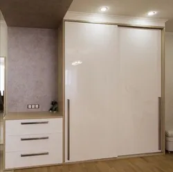 Wardrobe in the hallway white gloss with mirror photo