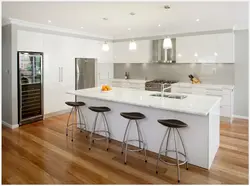 White kitchen with black countertop and bar counter photo