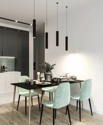 Green chairs in the interior of a gray kitchen