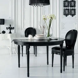 White table with black legs in the kitchen interior
