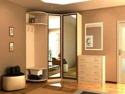 Corner wardrobe in the hallway with a mirror photo