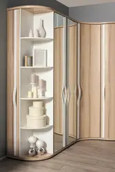 Photo of a corner wardrobe in the bedroom with a mirror