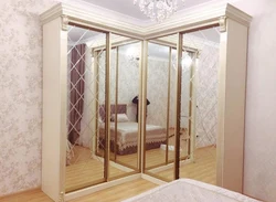 Photo of corner cabinets in the living room with a mirror