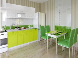 Photo of a kitchen with green chairs