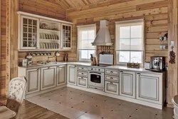 Photo of a white kitchen in a wooden house