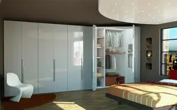 Photo of a bedroom closet up to the ceiling