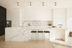 White kitchen with marble splashback photo