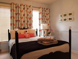 Colored curtains in the bedroom interior photo