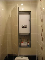 Photo of a toilet in an apartment with a boiler