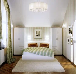 Bedroom with double bed and wardrobe photo