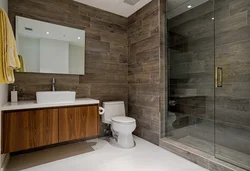 Bathroom design gray porcelain tiles and wood