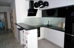 White and black kitchens with bar counters photo