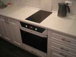 Cooktop and cabinet photo in the kitchen