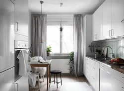 Kitchen With Balcony Design In Gray Color