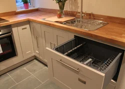 Corner kitchen design photo with dishwasher