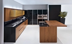 Black and white kitchen with wooden countertop photo