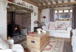 Living room in a wooden house with a stove photo