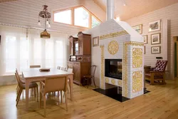 Living room in a wooden house with a stove photo