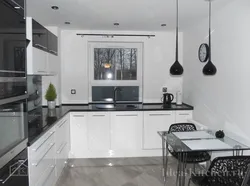 Gray white kitchen with black countertop photo