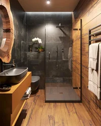 Bathroom Design With Dark Tiles And Wood