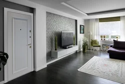 Apartment interior with dark floor and white doors