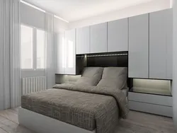 Bedroom design with two wardrobes next to the bed