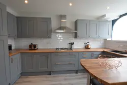 Gray kitchen design with wooden countertops