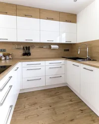 White kitchen with wooden countertop photo