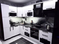 White glossy kitchen with black countertop photo