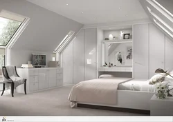 Bedroom interior in a house with a sloping ceiling