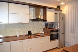 Photo of a linear kitchen with a refrigerator