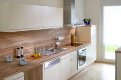 Photo of a kitchen with a wood-colored countertop