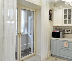 Interior of a kitchen with a balcony door