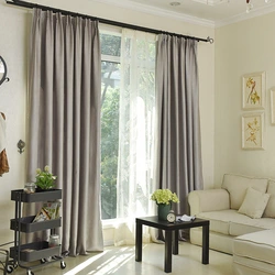 Как правильно подобрать шторы к интерьеру гостиной в квартире