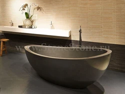 Bathtub with artificial stone photo