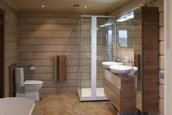 Design of a bath with toilet and shower in a wooden house