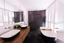 Bath with black floor and white walls photo