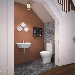 Bathroom under stairs design