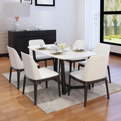 White Chairs And Table In The Kitchen Interior
