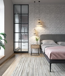 Bedroom with brick wall design photo