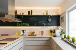Photo of a kitchen without upper cabinets with an apron